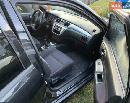 Черный Мицубиси Лансер, объемом двигателя 2 л и пробегом 212 тыс. км за 4500 $, фото 6 на Automoto.ua