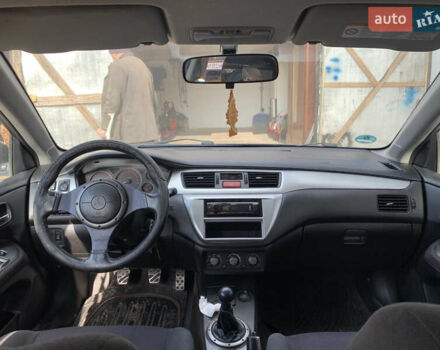 Черный Мицубиси Лансер, объемом двигателя 2 л и пробегом 212 тыс. км за 4500 $, фото 7 на Automoto.ua