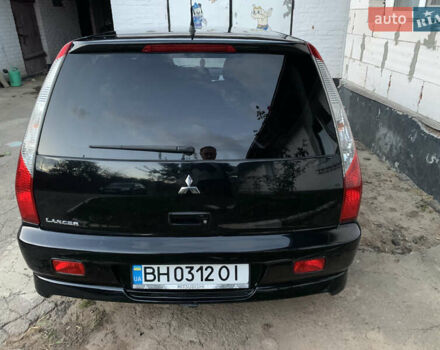 Черный Мицубиси Лансер, объемом двигателя 2 л и пробегом 212 тыс. км за 4500 $, фото 4 на Automoto.ua