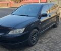 Черный Мицубиси Лансер, объемом двигателя 1.6 л и пробегом 350 тыс. км за 4450 $, фото 1 на Automoto.ua