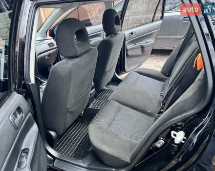Чорний Міцубісі Lancer, об'ємом двигуна 1.6 л та пробігом 220 тис. км за 5500 $, фото 10 на Automoto.ua