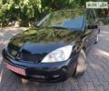 Чорний Міцубісі Lancer, об'ємом двигуна 1.6 л та пробігом 252 тис. км за 4900 $, фото 1 на Automoto.ua