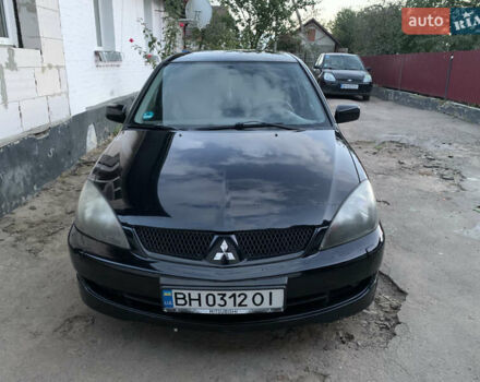 Черный Мицубиси Лансер, объемом двигателя 2 л и пробегом 212 тыс. км за 4500 $, фото 2 на Automoto.ua