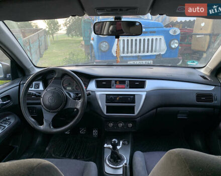 Черный Мицубиси Лансер, объемом двигателя 2 л и пробегом 212 тыс. км за 4500 $, фото 5 на Automoto.ua