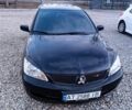 Чорний Міцубісі Lancer, об'ємом двигуна 1.6 л та пробігом 200 тис. км за 3009 $, фото 3 на Automoto.ua