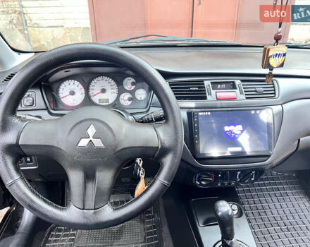 Чорний Міцубісі Lancer, об'ємом двигуна 1.6 л та пробігом 220 тис. км за 5500 $, фото 7 на Automoto.ua