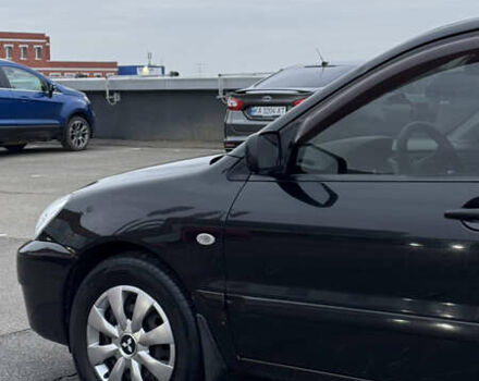 Чорний Міцубісі Lancer, об'ємом двигуна 1.58 л та пробігом 260 тис. км за 3299 $, фото 9 на Automoto.ua