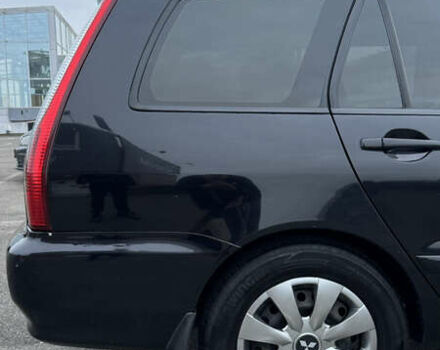 Чорний Міцубісі Lancer, об'ємом двигуна 1.58 л та пробігом 260 тис. км за 3299 $, фото 7 на Automoto.ua