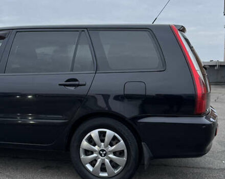 Чорний Міцубісі Lancer, об'ємом двигуна 1.58 л та пробігом 260 тис. км за 3299 $, фото 8 на Automoto.ua