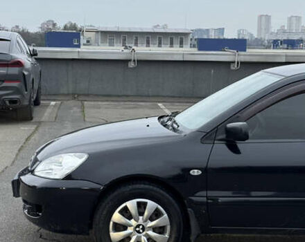Чорний Міцубісі Lancer, об'ємом двигуна 1.58 л та пробігом 260 тис. км за 3299 $, фото 16 на Automoto.ua