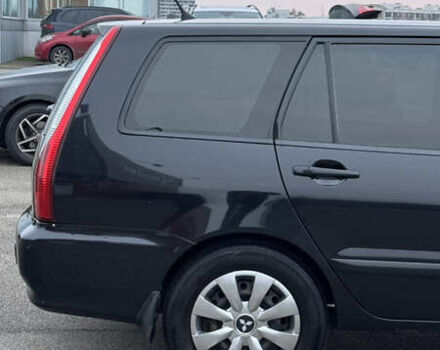 Чорний Міцубісі Lancer, об'ємом двигуна 1.58 л та пробігом 260 тис. км за 3299 $, фото 5 на Automoto.ua