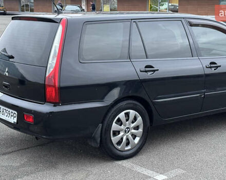 Чорний Міцубісі Lancer, об'ємом двигуна 1.58 л та пробігом 260 тис. км за 3299 $, фото 6 на Automoto.ua