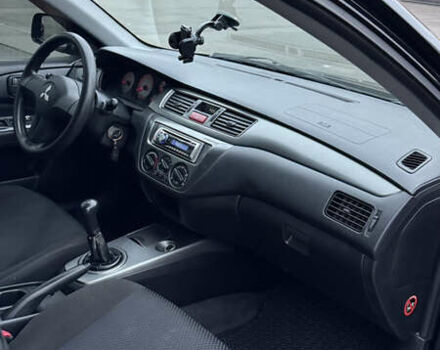 Чорний Міцубісі Lancer, об'ємом двигуна 1.58 л та пробігом 260 тис. км за 3299 $, фото 31 на Automoto.ua