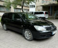 Чорний Міцубісі Lancer, об'ємом двигуна 1.58 л та пробігом 236 тис. км за 4200 $, фото 1 на Automoto.ua