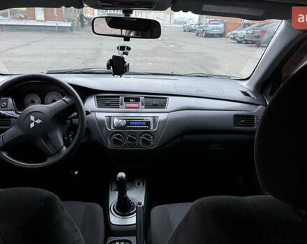 Чорний Міцубісі Lancer, об'ємом двигуна 1.58 л та пробігом 260 тис. км за 3299 $, фото 19 на Automoto.ua