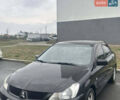 Чорний Міцубісі Lancer, об'ємом двигуна 1.58 л та пробігом 240 тис. км за 4000 $, фото 1 на Automoto.ua