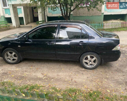 Чорний Міцубісі Lancer, об'ємом двигуна 1.58 л та пробігом 240 тис. км за 4000 $, фото 1 на Automoto.ua