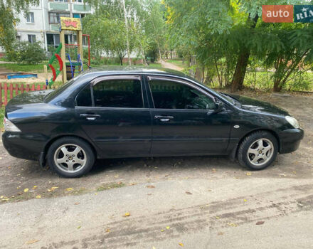 Чорний Міцубісі Lancer, об'ємом двигуна 1.58 л та пробігом 240 тис. км за 4000 $, фото 3 на Automoto.ua