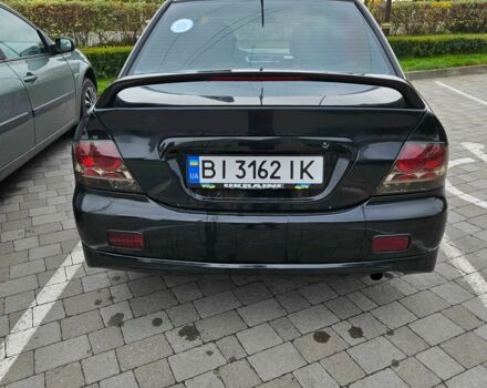 Міцубісі Lancer 2007 у Горішні Плавні (Комсомольськ) на Automoto.ua Чорний Міцубісі Lancer, об'ємом двигуна 2 л та пробігом 237 тис. км за 4300 $, фото 3 на Automoto.ua
