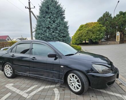 Міцубісі Lancer 2007 у Горішні Плавні (Комсомольськ) на Automoto.ua Чорний Міцубісі Lancer, об'ємом двигуна 2 л та пробігом 237 тис. км за 4300 $, фото 1 на Automoto.ua