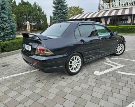 Міцубісі Lancer 2007 у Горішні Плавні (Комсомольськ) на Automoto.ua Чорний Міцубісі Lancer, об'ємом двигуна 2 л та пробігом 237 тис. км за 4300 $, фото 2 на Automoto.ua
