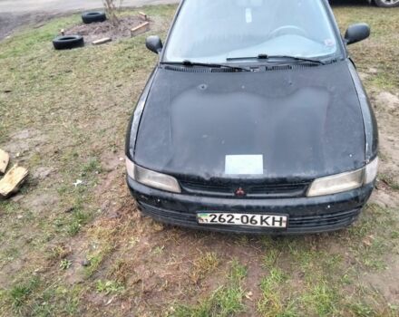 Черный Мицубиси Лансер, объемом двигателя 2 л и пробегом 380 тыс. км за 800 $, фото 1 на Automoto.ua