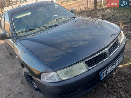 Мицубиси Лансер 1998 в Первомайск на Automoto.ua Черный Мицубиси Лансер, объемом двигателя 1.3 л и пробегом 300 тыс. км за 2000 $, фото 1 на Automoto.ua