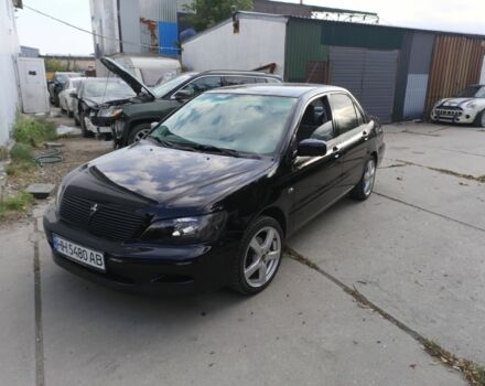 Черный Мицубиси Лансер, объемом двигателя 2 л и пробегом 270 тыс. км за 3800 $, фото 1 на Automoto.ua