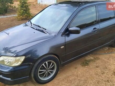 Чорний Міцубісі Lancer, об'ємом двигуна 2 л та пробігом 300 тис. км за 3500 $, фото 1 на Automoto.ua