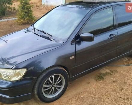 Чорний Міцубісі Lancer, об'ємом двигуна 2 л та пробігом 300 тис. км за 3500 $, фото 1 на Automoto.ua