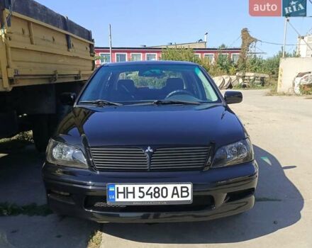 Черный Мицубиси Лансер, объемом двигателя 2 л и пробегом 270 тыс. км за 3800 $, фото 1 на Automoto.ua