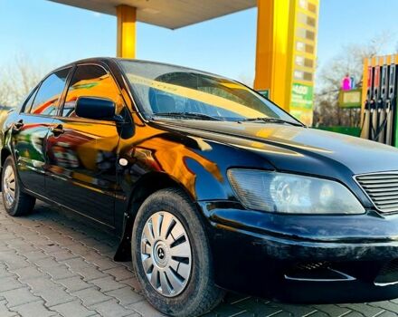 Чорний Міцубісі Lancer, об'ємом двигуна 2 л та пробігом 0 тис. км за 3300 $, фото 1 на Automoto.ua