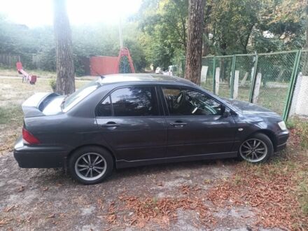 Чорний Міцубісі Lancer, об'ємом двигуна 2 л та пробігом 270 тис. км за 3699 $, фото 1 на Automoto.ua