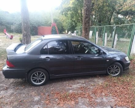 Чорний Міцубісі Lancer, об'ємом двигуна 2 л та пробігом 270 тис. км за 3699 $, фото 1 на Automoto.ua
