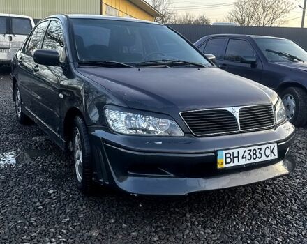 Черный Мицубиси Лансер, объемом двигателя 2 л и пробегом 1850 тыс. км за 2700 $, фото 1 на Automoto.ua