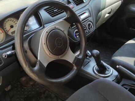 Міцубісі Lancer 2003 у Харкові на Automoto.ua Чорний Міцубісі Lancer, об'ємом двигуна 2 л та пробігом 347 тис. км за 3500 $, фото 1 на Automoto.ua
