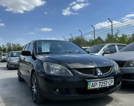 Чорний Міцубісі Lancer, об'ємом двигуна 2 л та пробігом 410 тис. км за 3900 $, фото 1 на Automoto.ua