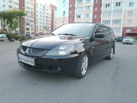 Міцубісі Lancer 2003 у Харкові на Automoto.ua Чорний Міцубісі Lancer, об'ємом двигуна 2 л та пробігом 320 тис. км за 3650 $, фото 1 на Automoto.ua
