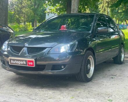 Чорний Міцубісі Lancer, об'ємом двигуна 1.6 л та пробігом 270 тис. км за 6490 $, фото 1 на Automoto.ua