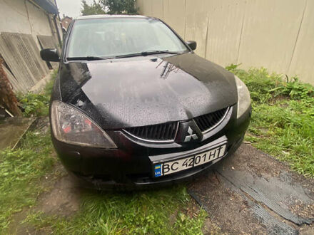 Міцубісі Lancer 2003 у Хмельницькому на Automoto.ua Чорний Міцубісі Lancer, об'ємом двигуна 2 л та пробігом 289 тис. км за 3600 $, фото 1 на Automoto.ua