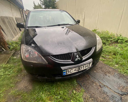 Чорний Міцубісі Lancer, об'ємом двигуна 2 л та пробігом 289 тис. км за 3600 $, фото 1 на Automoto.ua