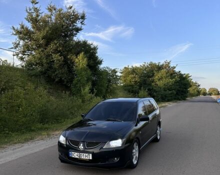 Черный Мицубиси Лансер, объемом двигателя 2 л и пробегом 295 тыс. км за 4100 $, фото 1 на Automoto.ua