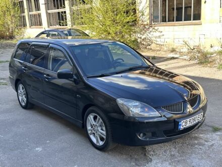 Мицубиси Лансер 2003 в Чернигове на Automoto.ua Черный Мицубиси Лансер, объемом двигателя 1.6 л и пробегом 200 тыс. км за 3350 $, фото 1 на Automoto.ua