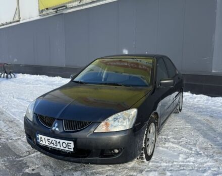 Чорний Міцубісі Lancer, об'ємом двигуна 1.6 л та пробігом 345 тис. км за 3300 $, фото 1 на Automoto.ua