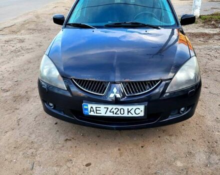Чорний Міцубісі Lancer, об'ємом двигуна 1.6 л та пробігом 290 тис. км за 1999 $, фото 1 на Automoto.ua