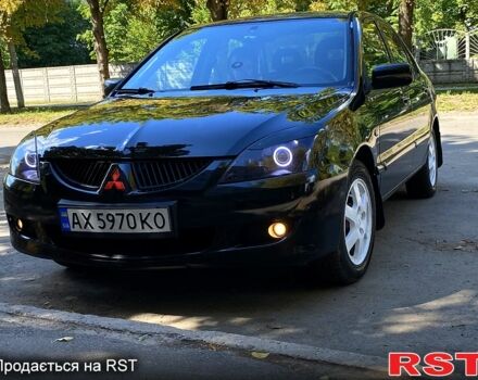 Чорний Міцубісі Lancer, об'ємом двигуна 1.6 л та пробігом 270 тис. км за 4500 $, фото 1 на Automoto.ua