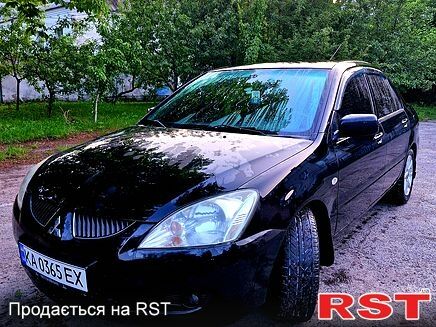Черный Мицубиси Лансер, объемом двигателя 1.6 л и пробегом 271 тыс. км за 3500 $, фото 1 на Automoto.ua
