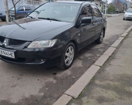 Черный Мицубиси Лансер, объемом двигателя 1.6 л и пробегом 230 тыс. км за 3600 $, фото 1 на Automoto.ua