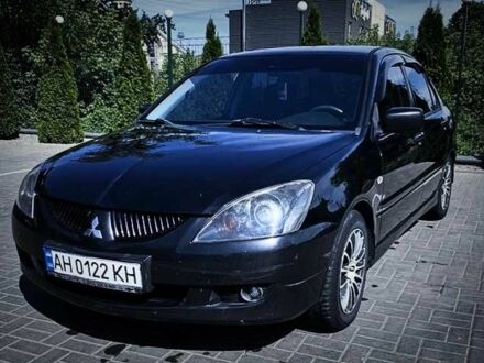 Міцубісі Lancer 2004 у Славянске на Automoto.ua Чорний Міцубісі Lancer, об'ємом двигуна 2 л та пробігом 290 тис. км за 5550 $, фото 1 на Automoto.ua