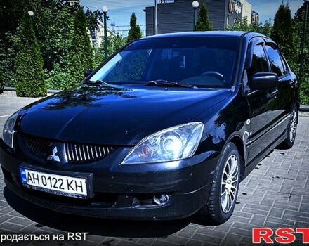 Черный Мицубиси Лансер, объемом двигателя 2 л и пробегом 285 тыс. км за 4750 $, фото 1 на Automoto.ua